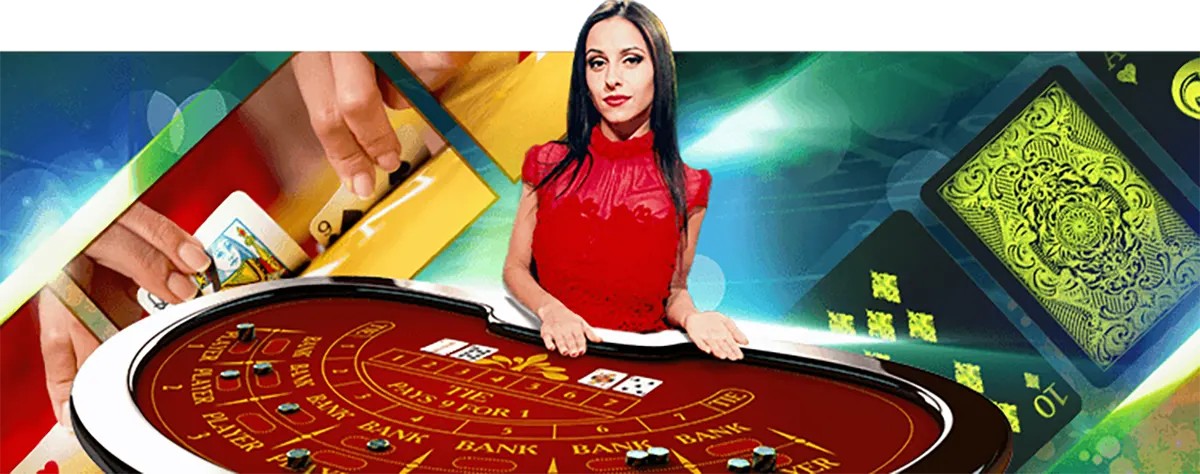 Promotional casino image showing a female dealer in a red dress leaning over a red baccarat-style table with cards and chips, set against a dynamic background of hands dealing cards and large green playing-card graphics.